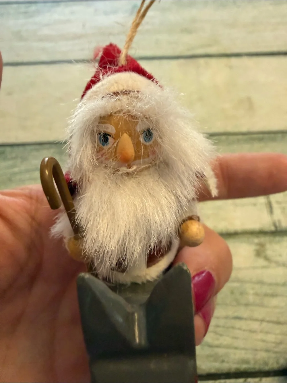 Vintage Christmas wood Santa riding a donkey horse ornament.